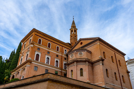 A majestic building with a clock tower, showcasing medieval architecture.