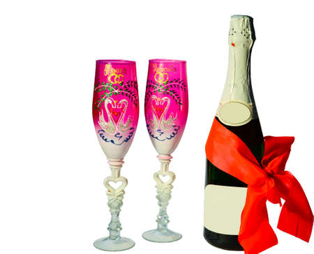 two goblet and champagne on a white backgroundの写真素材