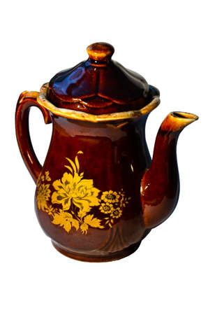 A ceramic kettle with a pattern on a white backgroundの写真素材