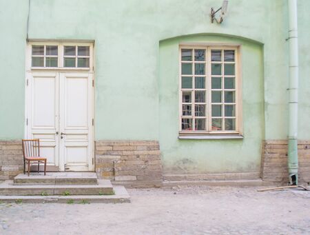 Old courtyard, the entrance to the house and the window of the communalの写真素材