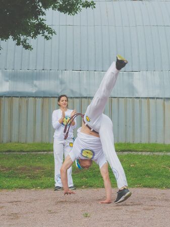 Russia Nikolskoe July 2016 competition in crossfit, the man in white shows dance capoeira as a martial artのeditorial素材