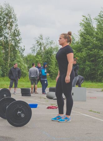 Russia Nikolskoe July 2016 competition at crossfit strong girl in black to prepare for the exerciseのeditorial素材