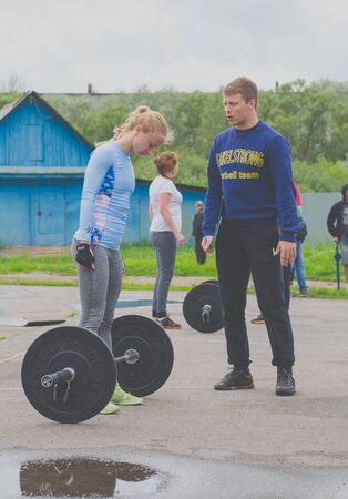 Russia Nikolskoe July 2016 competition in crossfit, the girl in blue to prepare for deadliftのeditorial素材