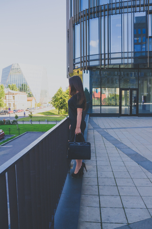 beautiful girl stands near the business centerの写真素材