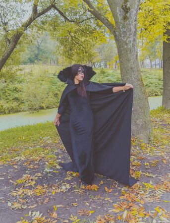 open Cape is a beautiful girl in a black mask.の写真素材