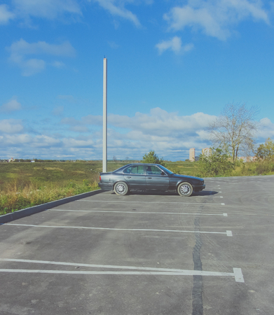 the Parking lot is another black car in the sky.の写真素材