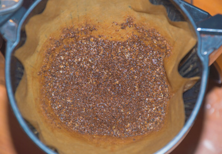 the coffee in the filter and brewed coffee close-up.の写真素材