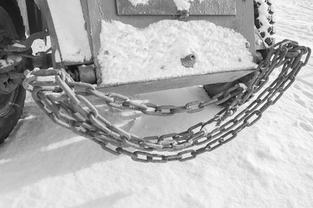 on the nose of the armored vehicle towing chain ,black and white.