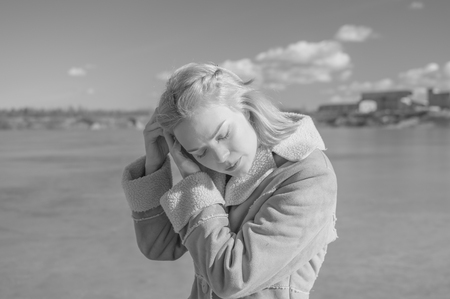 black and white, a Sunny day near a lake beautiful girl removes hair.の写真素材