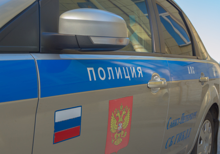 The inscription "Police" on the door of the car.のeditorial素材