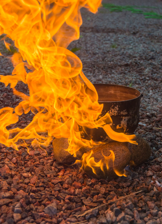 burn with a bright flame stones and camp pot.の写真素材
