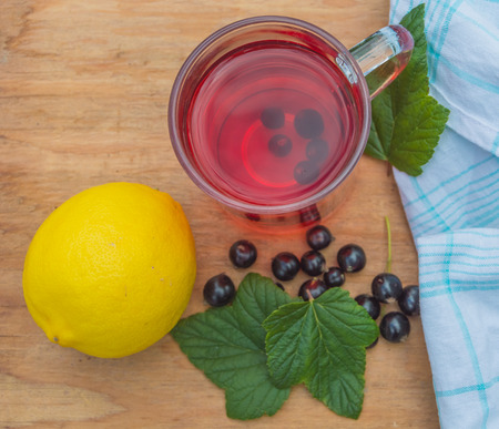 Tea from the berries of black currant with lemon.の写真素材
