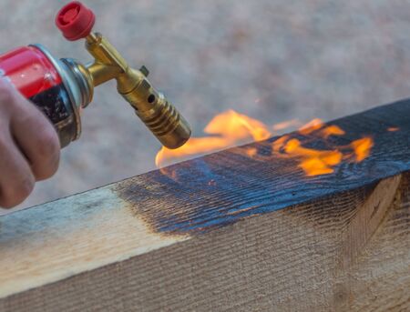 processing of wood, fire from a gas burner.の写真素材