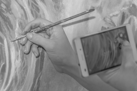 black and white. loseup, artistic girl photographs to your smartphone, your pictureの写真素材