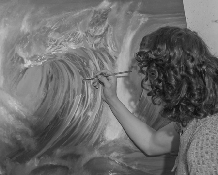 black and white. in workshop paints paints girl.の写真素材