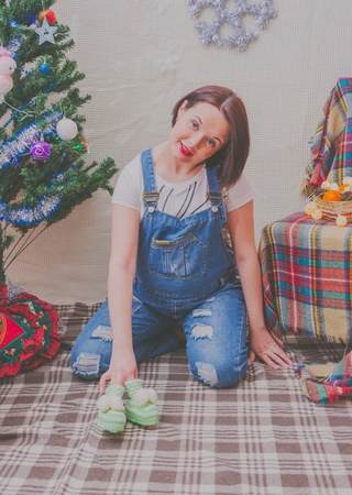 in the new year pregnant girl near Christmas treeの写真素材