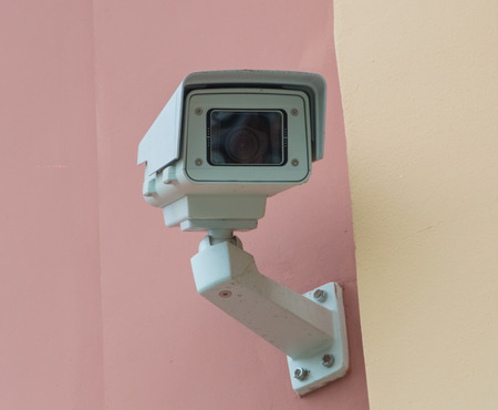 surveillance camera on the building wallの写真素材