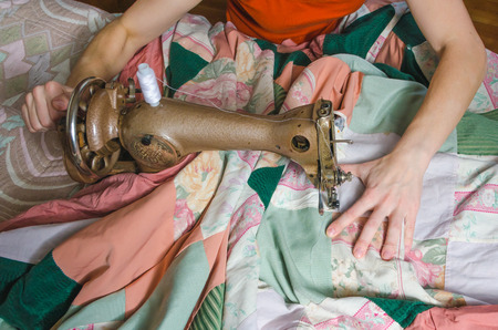 woman embroiders on the sewing machineの写真素材