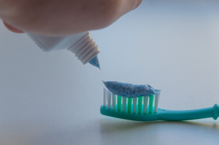 close-up, on the toothbrush smear toothpasteの写真素材