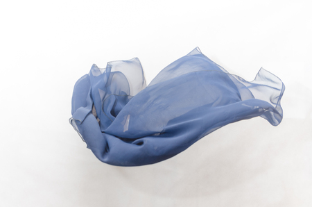 texture of dark blue fabric in flight on a grey backgroundの写真素材