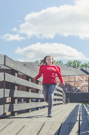 child, girl on the bridge, runningの写真素材