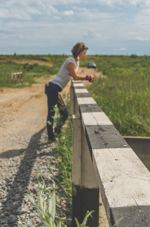 background, blurred, on the bridge girl in travel and carの写真素材