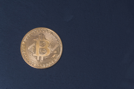 bitcoin gold coin on black backgroundの写真素材