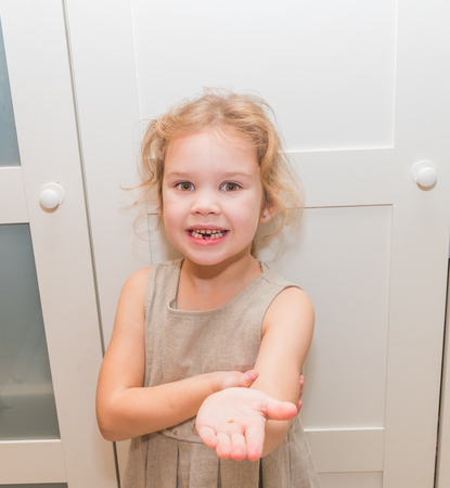 girl, a child lost a tooth, hole, oral hygieneの写真素材