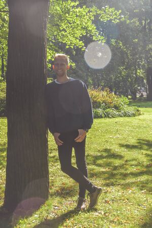 the young man with a beard in a Park among the trees