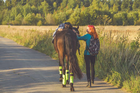 Russia Nikolskoye September 23, 2020 - boy rides a horse hippotherapy class