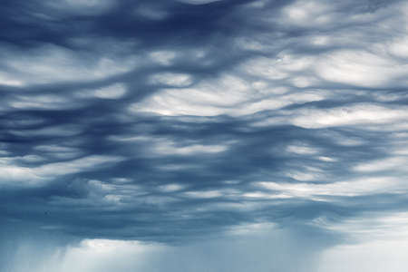 Background Wave storm clouds with rainの写真素材