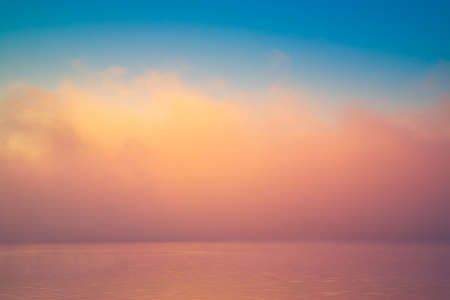 Amazing background fog cloud over river shiny wave at sunriseの写真素材