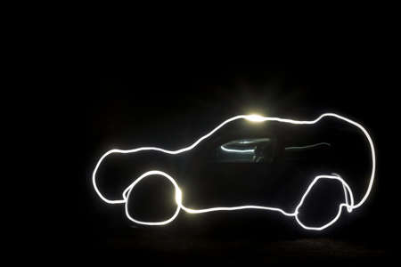 Painted light technology freezelight photo of the body of the SUV and the interior of the dark night.の写真素材