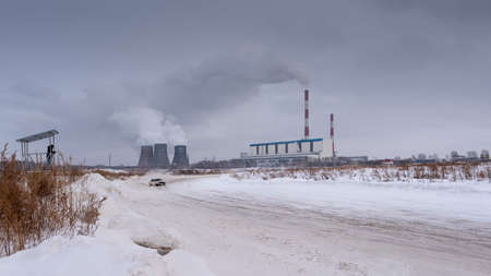 Russia, Novosibirsk - November 30, 2019. An unknown person looks at the old VAZ Zhiguli car that is going fast in Russian while standing on a raised platform.のeditorial素材