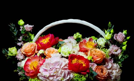 bright white flower basket on a dark backgroundの写真素材