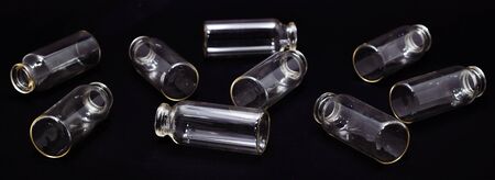 glass test tubes on a dark background