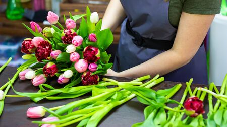 florist girl makes a bouquetの写真素材
