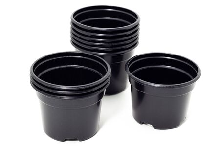 plastic black flowerpots on white backgroundの写真素材