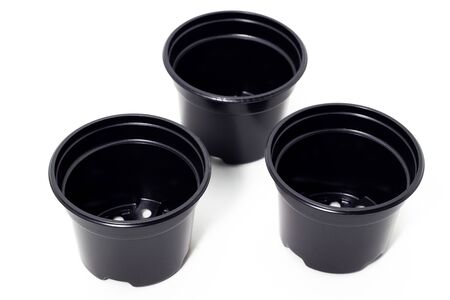 plastic black flowerpots on white backgroundの写真素材