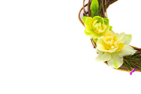wreath decorated with daffodils on a backgroundの写真素材