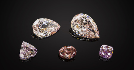Set of luxury pink and purple transparent sparkling gemstones of various cut shape diamonds collage on black background.の写真素材