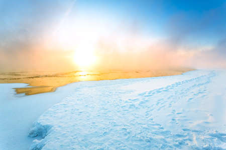 Morning fog on the river in winterの写真素材