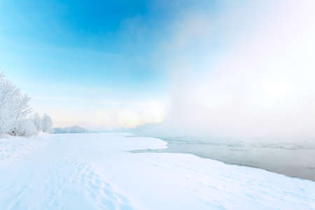 Morning fog on the river in winterの写真素材