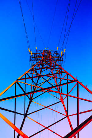 High voltage post. High-voltage tower sky background.