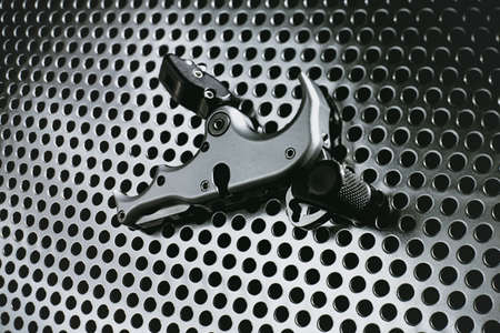Modern archery release for compound bow on a metal surface