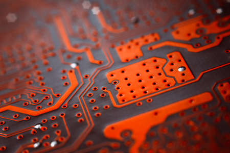 Bokeh electronic circuit close up computer in red colors