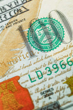 Fragment of a hundred dollar bill closeup