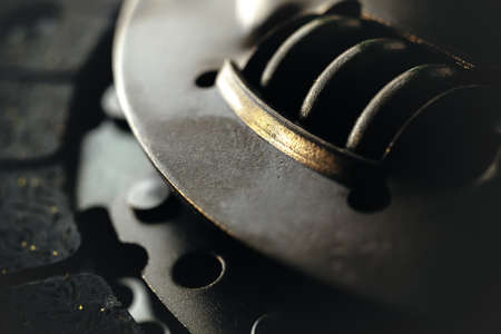 Car clutch on a metal surface. Photo from the classical vignetting effect it and a small depth of fieldの写真素材