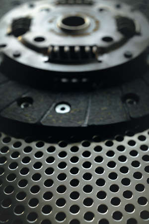 Car clutch on a metal surface. Photo from the classical vignetting effect it and a small depth of fieldの写真素材