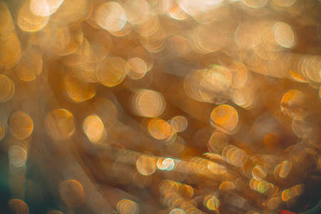 Golden streamers with sparkling glitter - Christmas holidays hackground. Selective focusの写真素材